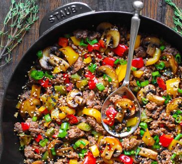 bowl of fresh vegetables with olive oil on a table