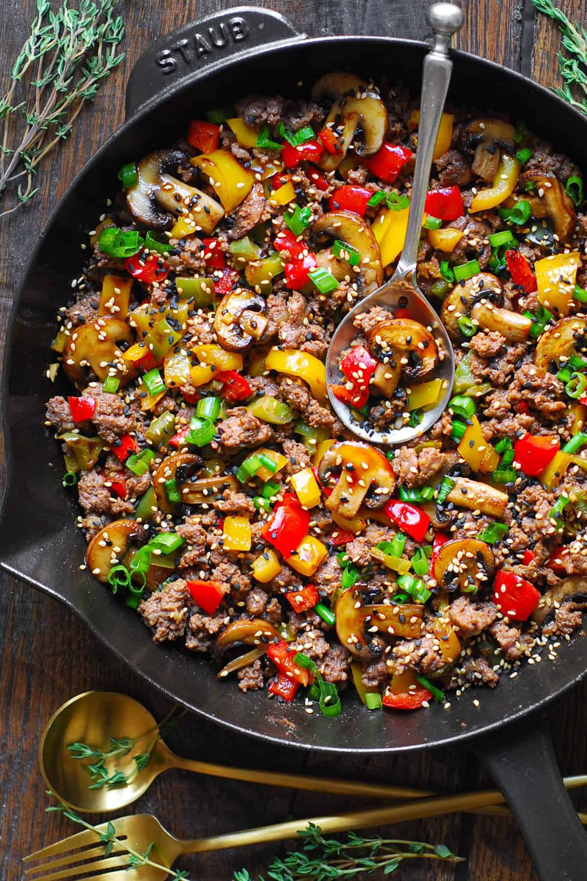 bowl of fresh vegetables with olive oil on a table