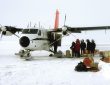 pale arctic sea ice meeting open ocean water at the floe edge
