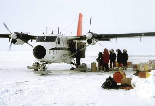 pale arctic sea ice meeting open ocean water at the floe edge