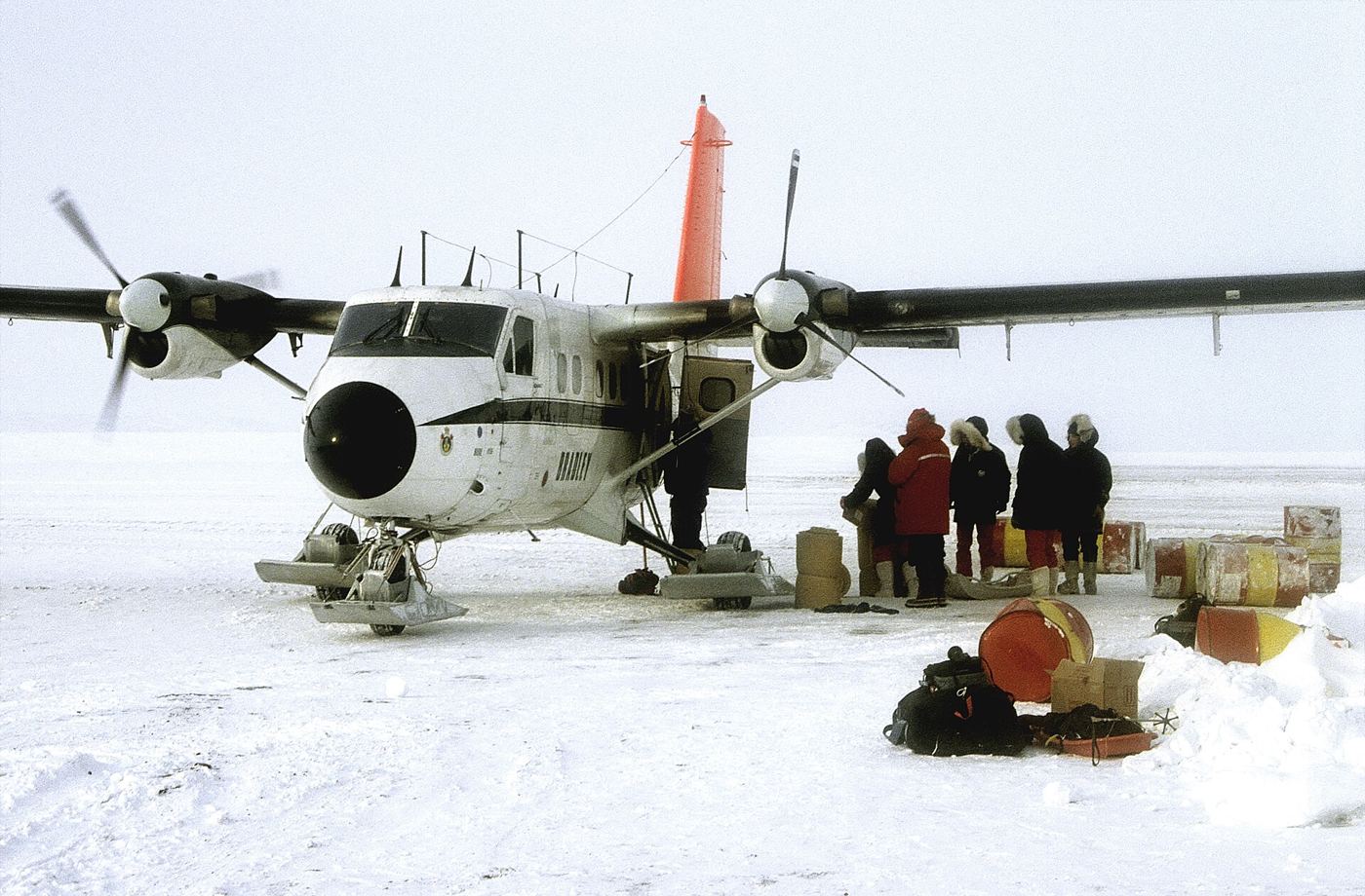pale arctic sea ice meeting open ocean water at the floe edge