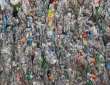 Compressed bales of used PET plastic bottles at a recycling facility