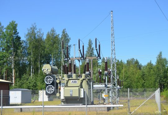 High-voltage power lines carrying electricity across the landscape
